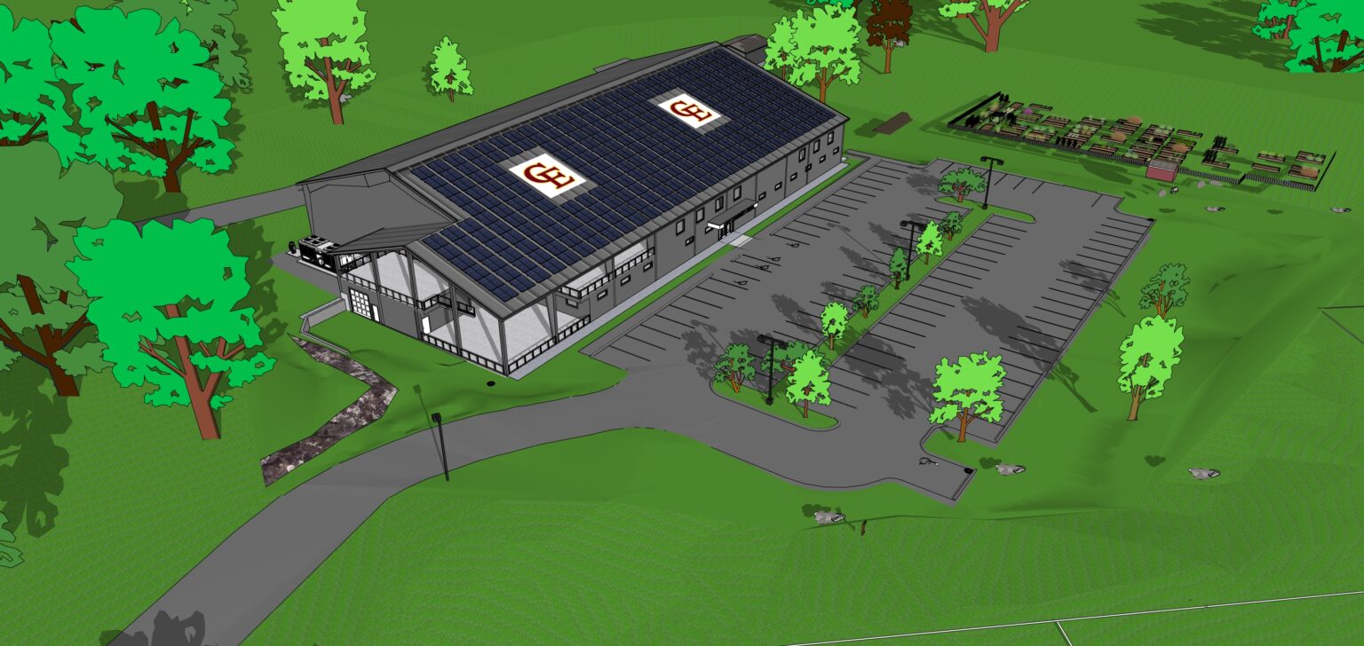 Aerial concept view of the completed arena: the building fully enclosed with cladding and windows, solar panels across the roof, and a finished parking lot with landscaped islands.