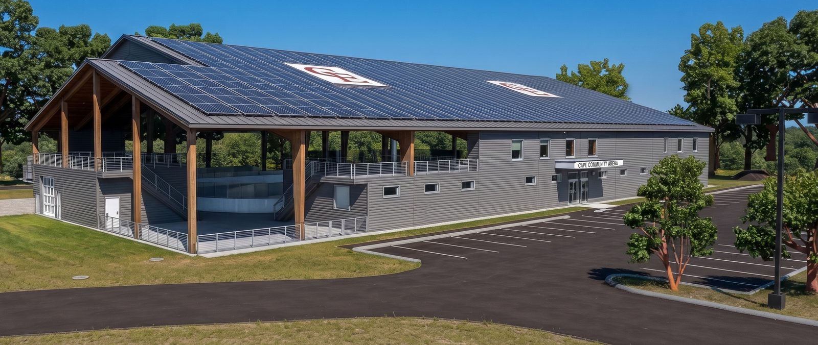 Concept rendering of the permanent arena at Gull Crest: a covered building with open sides, timber posts, and a solar roof, with the parking area in front.